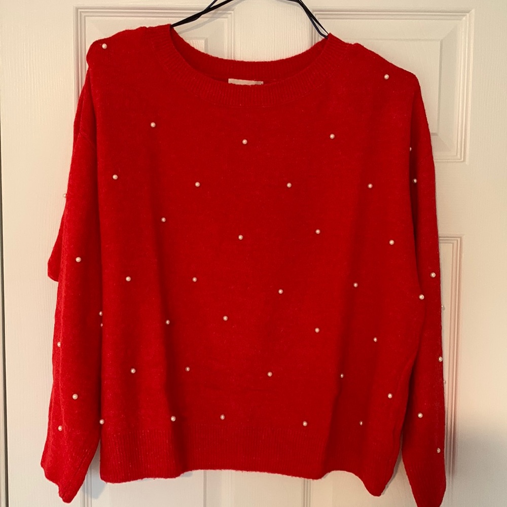Red sweater with pearls